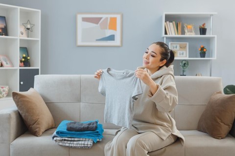 Woman displaying freshly washed clothes