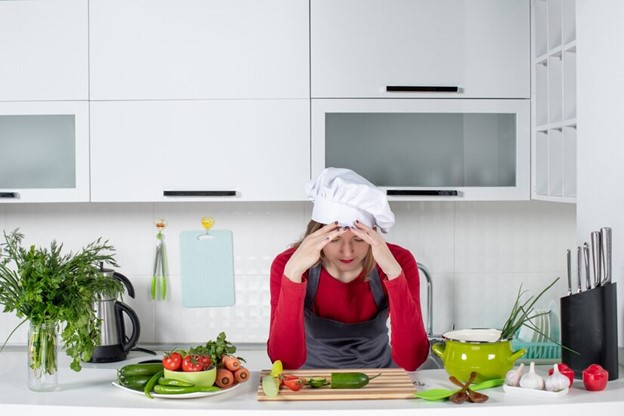 Woman distressed about kitchen bacteria
